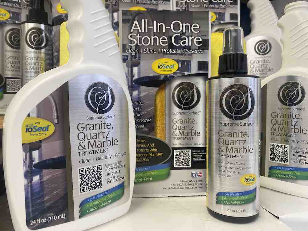 supreme surface all in one stone care granite quartz marble treatment with ioseal: Official picture, 24oz spray, 8oz spray, yellow microfiber towel, white quartz counter.